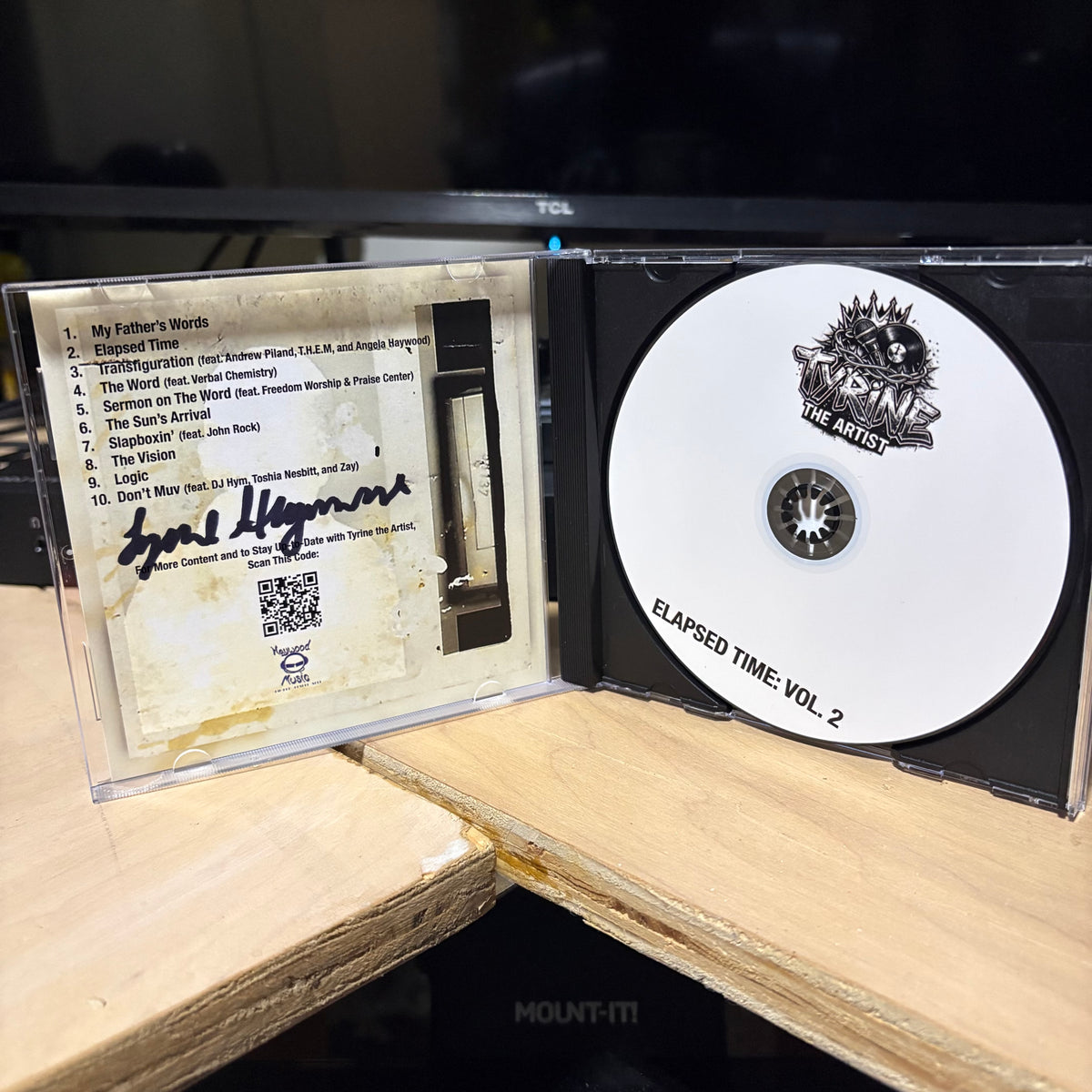 A CD case opened to show the album art and disc for 'Elapsed Time: Vol. 2' by the artist 'The Artists'.